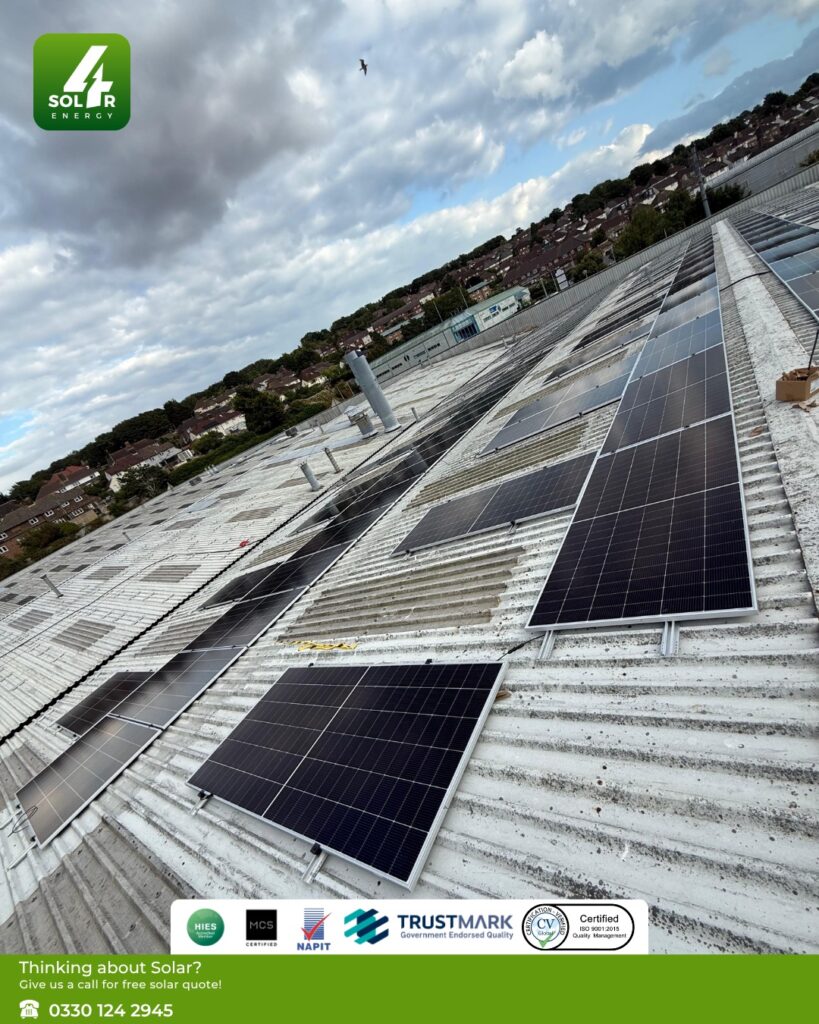 Sungrow 625W modules installed in rows across the T. Reeve and Sons roof under a cloudy Brighton sky